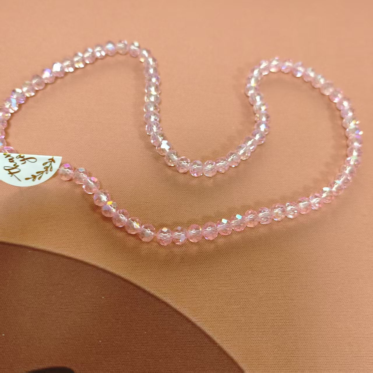 AJ048 (6mm Pnk Faceted Resin string Beads